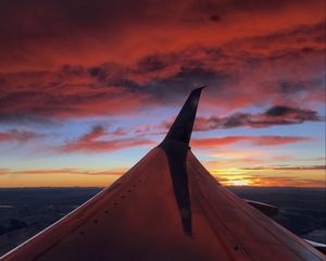 Preview wallpaper airplane, wing, clouds, sky, sunset