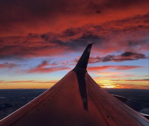 Preview wallpaper airplane, wing, clouds, sky, sunset