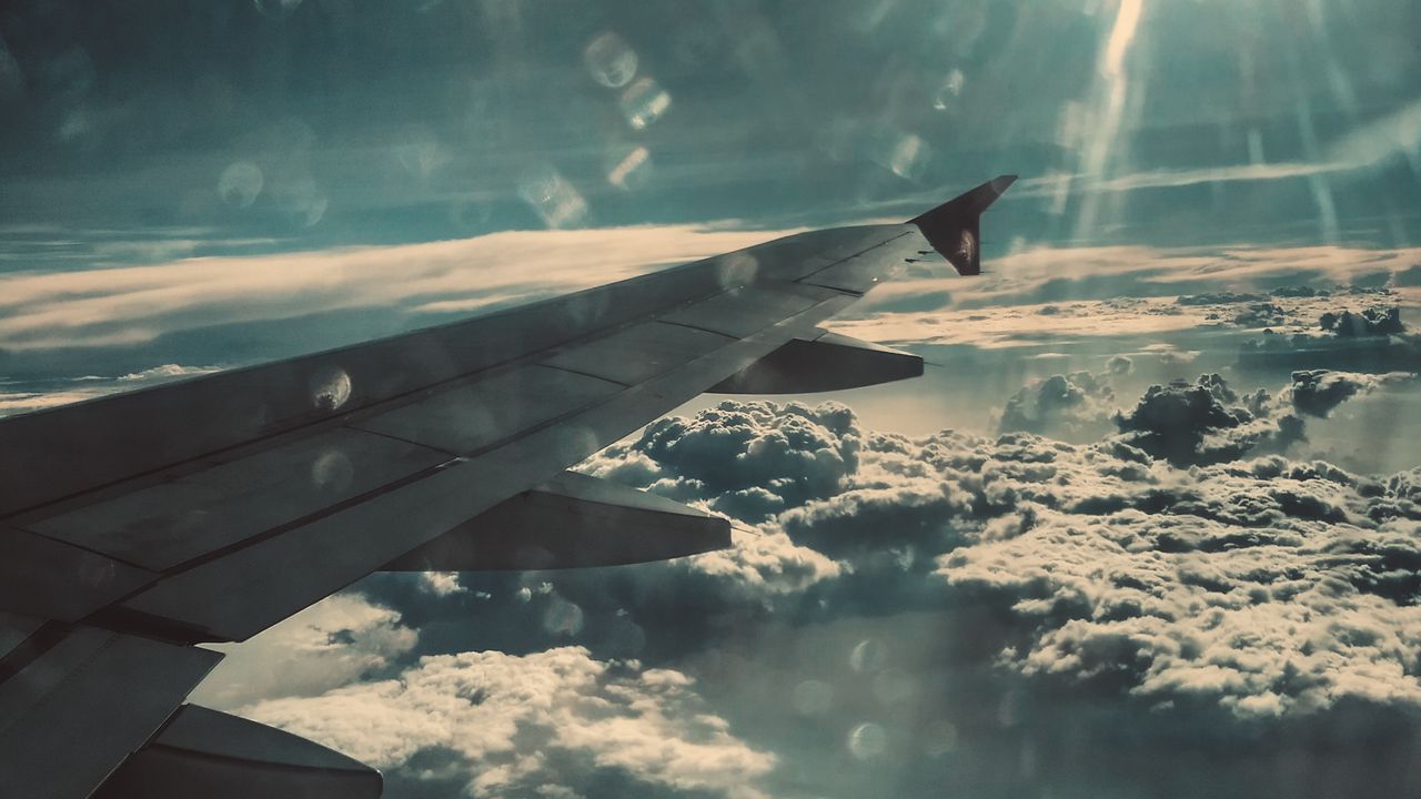 Wallpaper airplane wing, clouds, glare