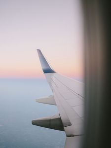 Preview wallpaper airplane wing, porthole, sky