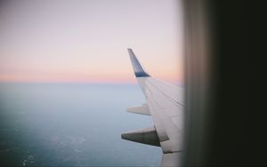 Preview wallpaper airplane wing, porthole, sky