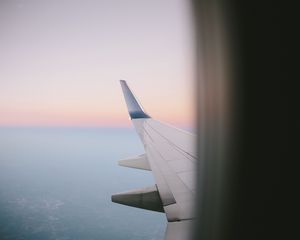 Preview wallpaper airplane wing, porthole, sky