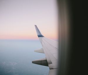 Preview wallpaper airplane wing, porthole, sky