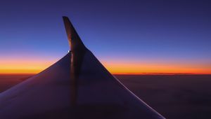 Preview wallpaper airplane wing, sky, flight, horizon, sunset