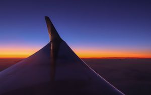 Preview wallpaper airplane wing, sky, flight, horizon, sunset