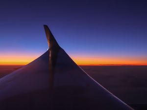 Preview wallpaper airplane wing, sky, flight, horizon, sunset