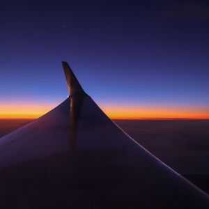 Preview wallpaper airplane wing, sky, flight, horizon, sunset