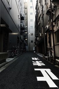 Preview wallpaper alley, buildings, asphalt, bicycles, urban