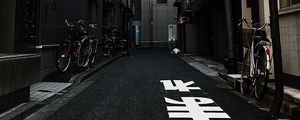 Preview wallpaper alley, buildings, asphalt, bicycles, urban