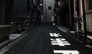 Preview wallpaper alley, buildings, asphalt, bicycles, urban