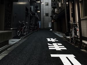 Preview wallpaper alley, buildings, asphalt, bicycles, urban