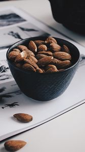 Preview wallpaper almonds, nuts, bowl, table, magazine