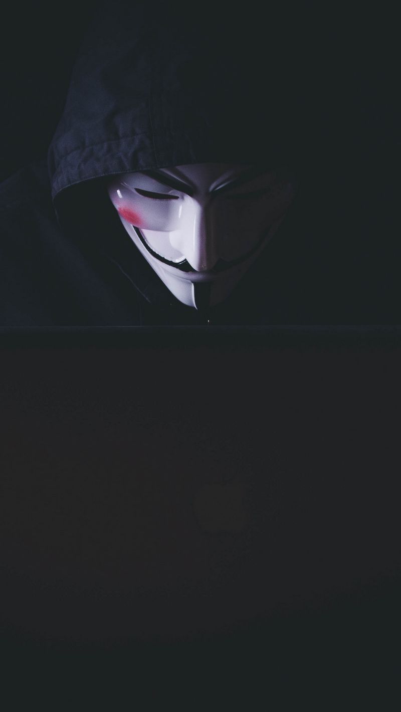 Download wallpaper 800x1420 anonymous, hacker, mask, hood, laptop, dark  iphone se/5s/5c/5 for parallax hd background