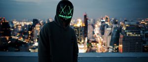 Preview wallpaper anonymous, mask, hood, hoodie, city, glow