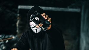 Preview wallpaper anonymous, mask, phone, person