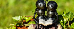 Preview wallpaper ants, insects, sculpture, bench, couple, book