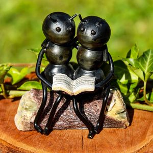 Preview wallpaper ants, insects, sculpture, bench, couple, book