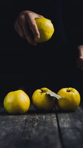Preview wallpaper apple, hand, fruit, dark background