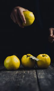 Preview wallpaper apple, hand, fruit, dark background