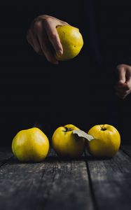 Preview wallpaper apple, hand, fruit, dark background