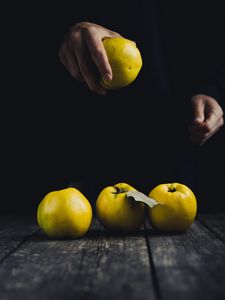 Preview wallpaper apple, hand, fruit, dark background