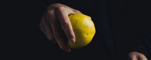 Preview wallpaper apple, hand, fruit, dark background