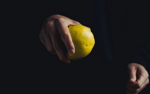 Preview wallpaper apple, hand, fruit, dark background