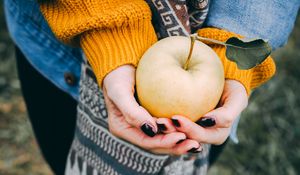 Preview wallpaper apple, hands, autumn, harvest