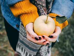 Preview wallpaper apple, hands, autumn, harvest