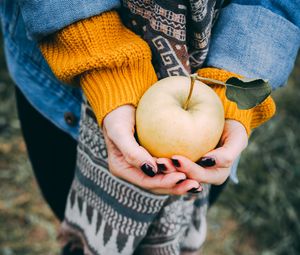 Preview wallpaper apple, hands, autumn, harvest