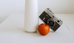 Preview wallpaper apple, orange, camera, vase, branch, decor