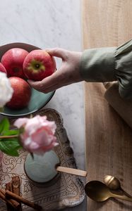 Preview wallpaper apples, fruit, hand, flowers