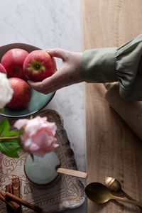 Preview wallpaper apples, fruit, hand, flowers