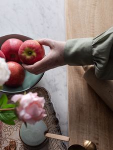 Preview wallpaper apples, fruit, hand, flowers