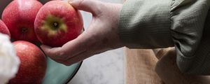 Preview wallpaper apples, fruit, hand, flowers