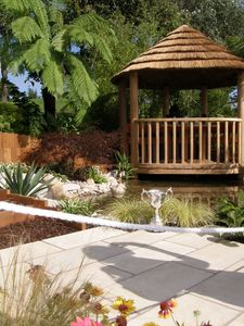 Preview wallpaper arbor, garden, tile, cup, shadow, vegetation, flowers, palm trees, lake, path