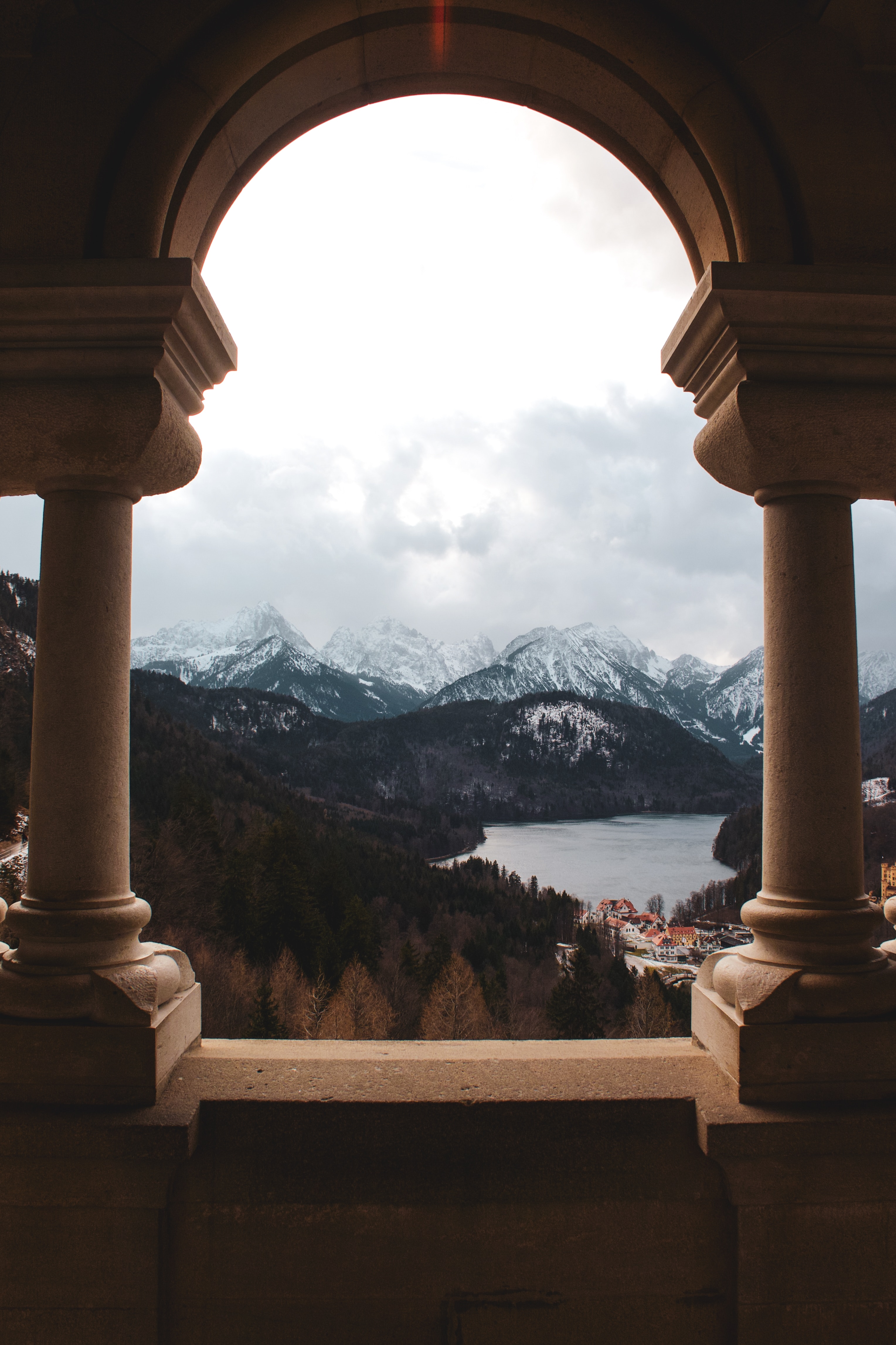 Download wallpaper 3057x4586 arch, columns, mountains, lake, landscape