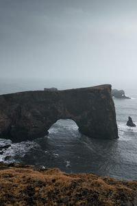 Preview wallpaper arch, rocks, cliff, sea, grass