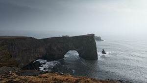 Preview wallpaper arch, rocks, cliff, sea, grass