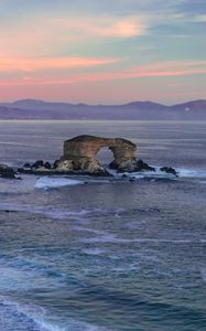 Preview wallpaper arch, rocks, sea, waves, sunset