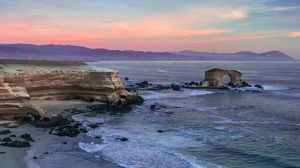 Preview wallpaper arch, rocks, sea, waves, sunset