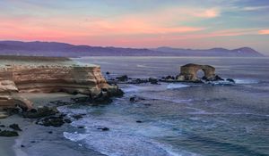 Preview wallpaper arch, rocks, sea, waves, sunset