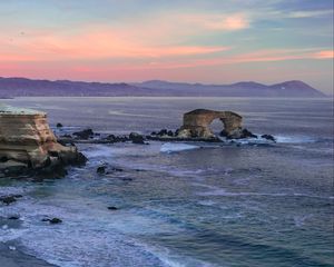 Preview wallpaper arch, rocks, sea, waves, sunset