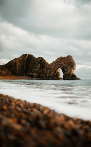 Preview wallpaper arch, rocks, shore, beach