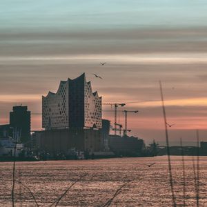 Preview wallpaper architecture, building, water, sunset