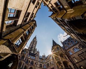 Preview wallpaper architecture, buildings, city, bottom view, rays