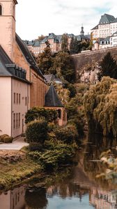 Preview wallpaper architecture, buildings, river, bushes, branches