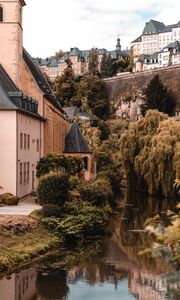Preview wallpaper architecture, buildings, river, bushes, branches