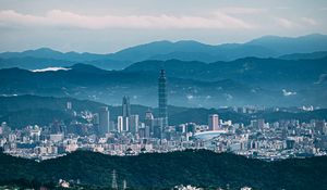Preview wallpaper architecture, tower, skyscraper, mountains, fog