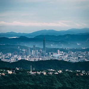 Preview wallpaper architecture, tower, skyscraper, mountains, fog